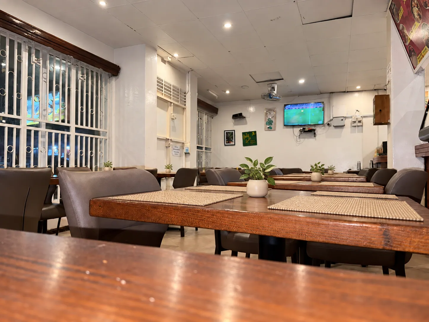 Close view across a polished wooden table at Parkvilla